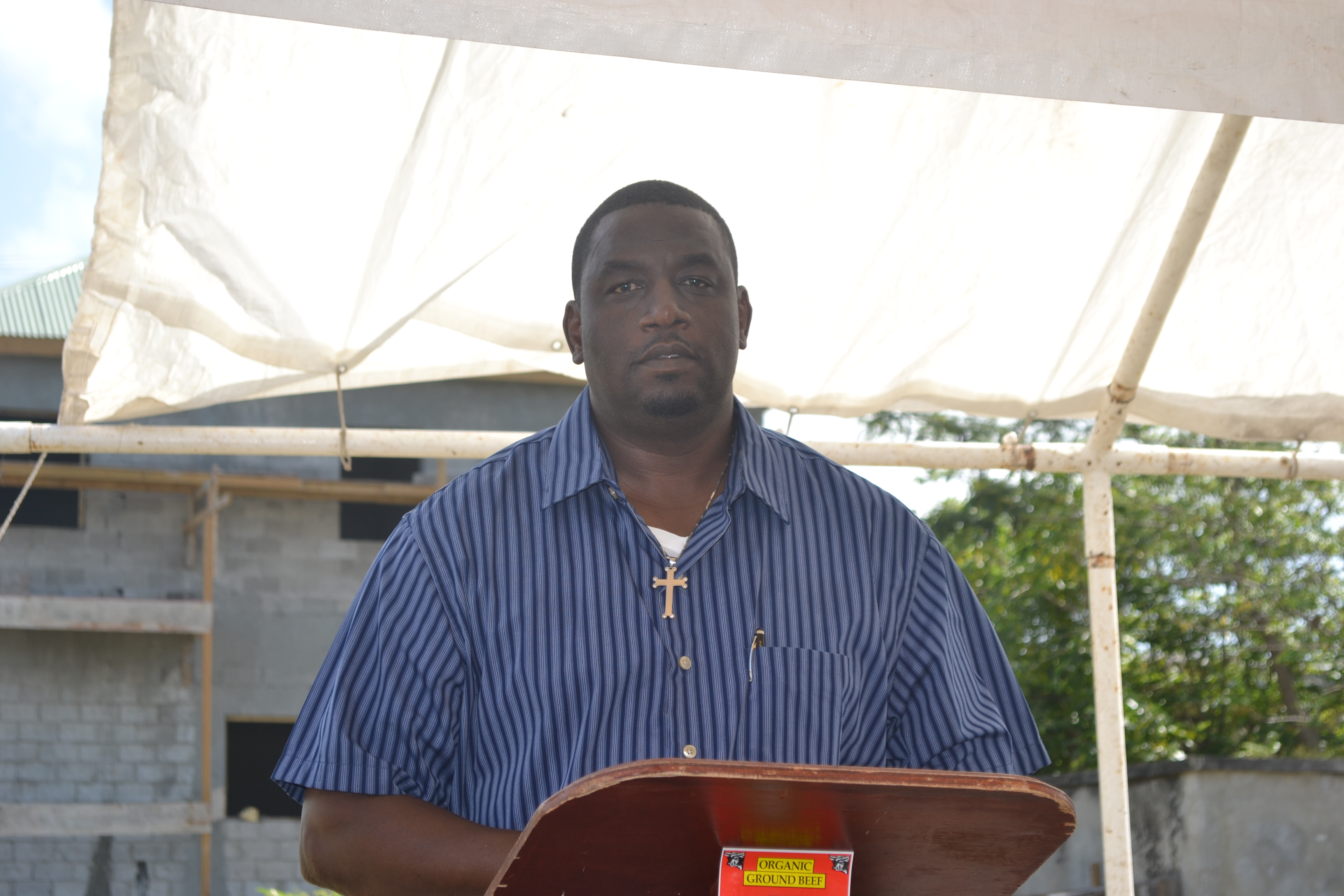 Manager of the Abattoir Mr. Garfield Griffin making remarks at the Ground Breaking Ceremony for the extension of the Abattoir Division on the Abattoir Division Grounds on January 26 2016